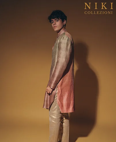 Man in a stylish, two-toned long kurta with gold pants