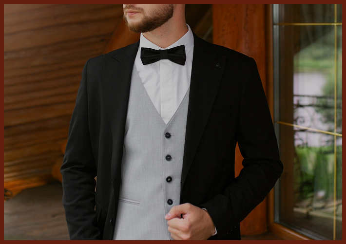 Person in a tuxedo with bow tie.