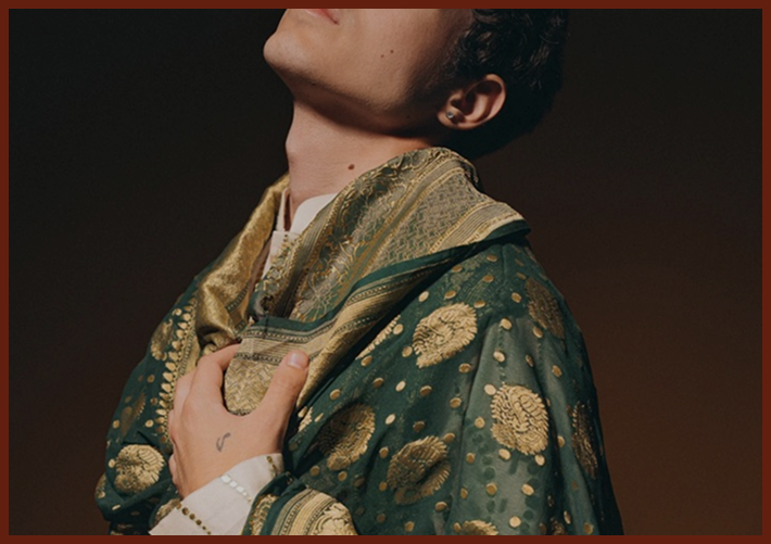 Person in green and gold kurta.