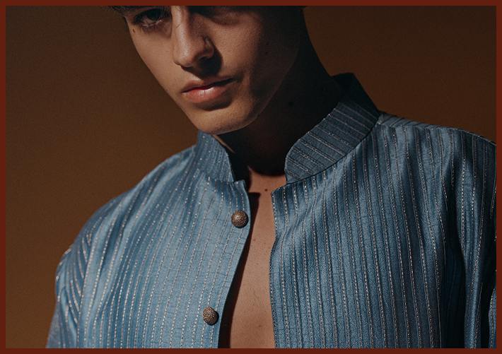 Person in azure silk kurta